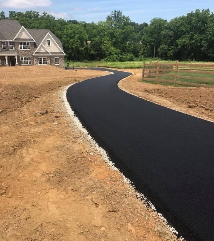 Newly paved residential asphalt driveway by D&H Paving
