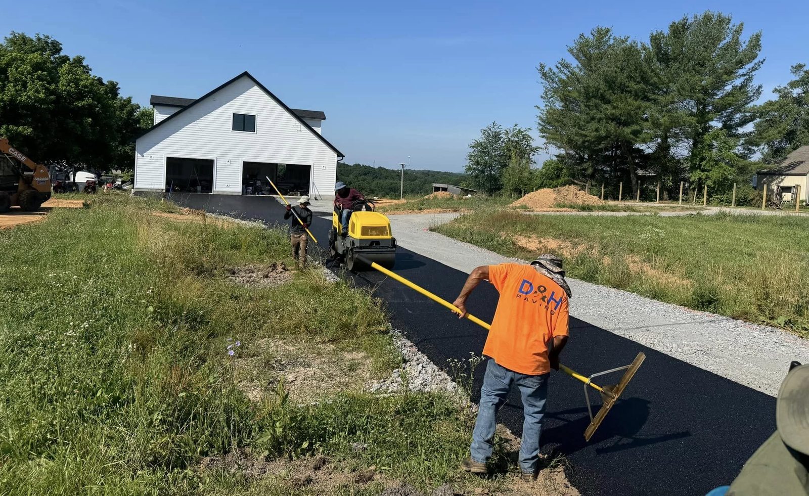 Custom tar and chip driveway installed by D&H Paving